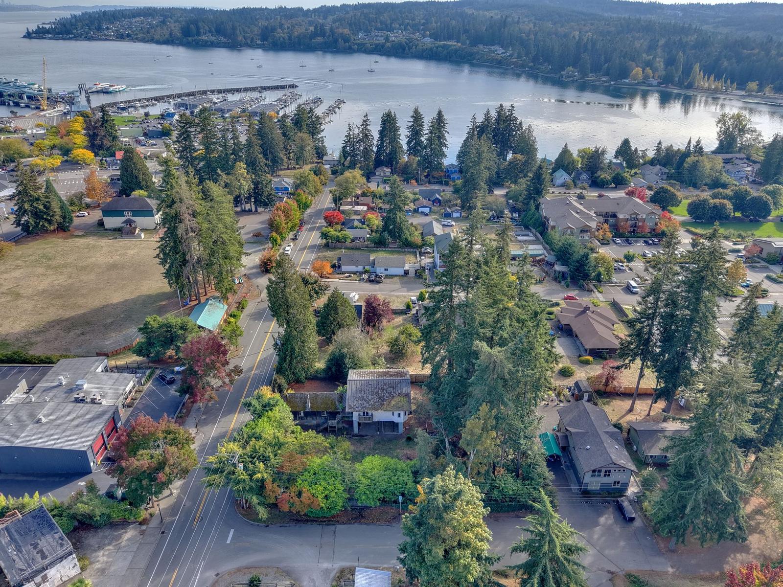 Aerial view of 26175 Bannister St NE in downtown Kingston, WA, with Appletree Cove and the marina behind it